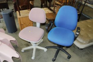 Two swivel office chairs
