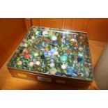 A tin of vintage glass and other marbles