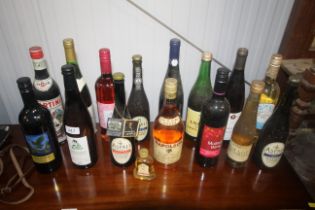 A collection of alcohol to include wine, brandy et