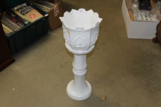 A white glazed jardiniere and stand