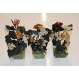 Three Chinese hardstone flower arrangements in pot