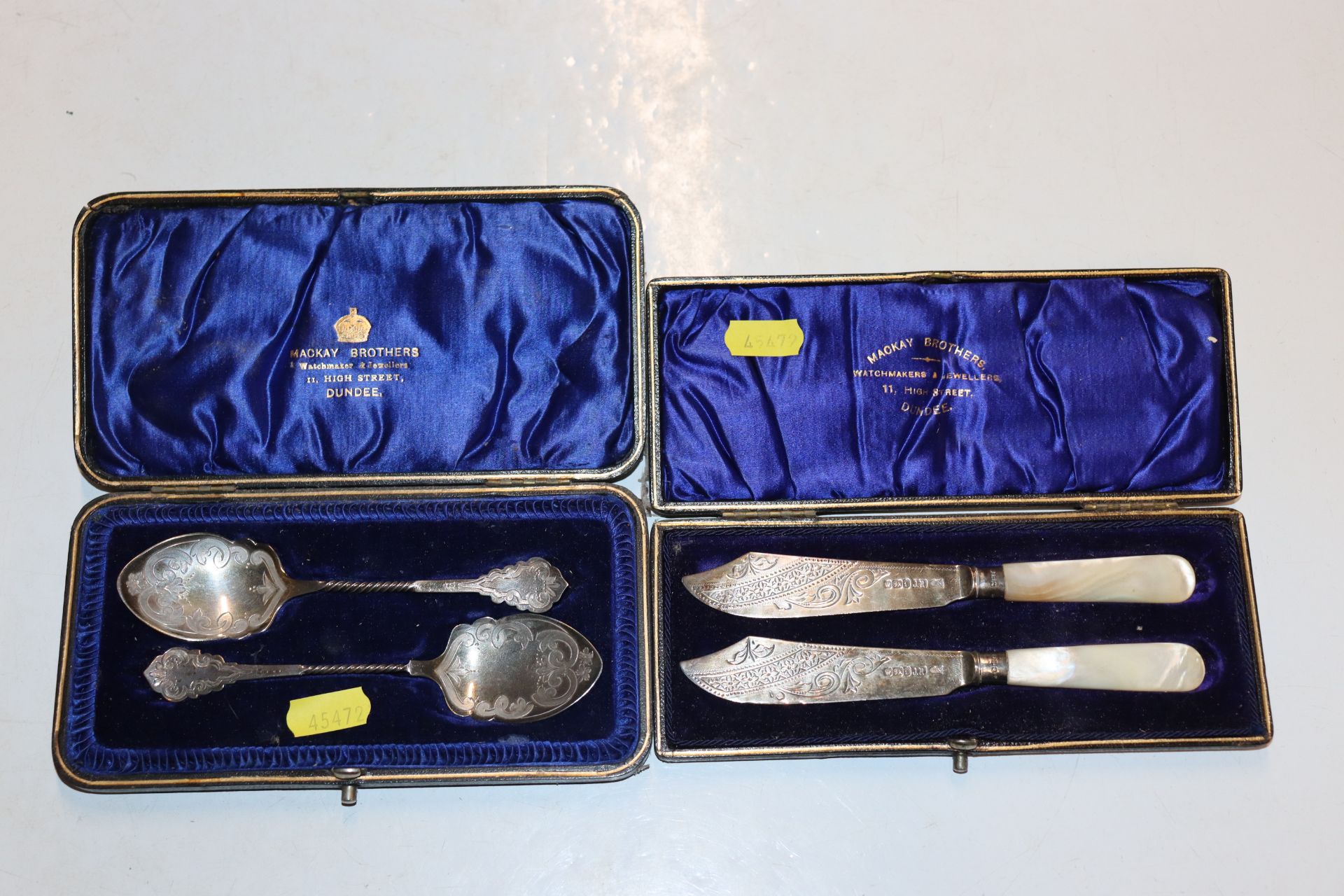 A cased pair of silver knives with mother of pearl