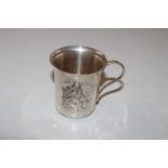 A white metal cup decorated with Puss In Boots, ap