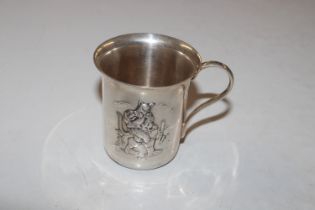 A white metal cup decorated with Puss In Boots, ap