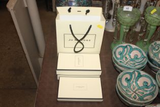 Two Jo Malone Perfume boxes and a gift bag