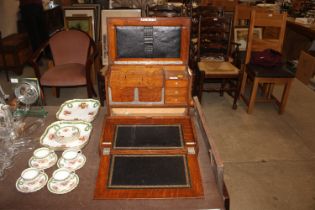 A late Victorian oak stationery cabinet
