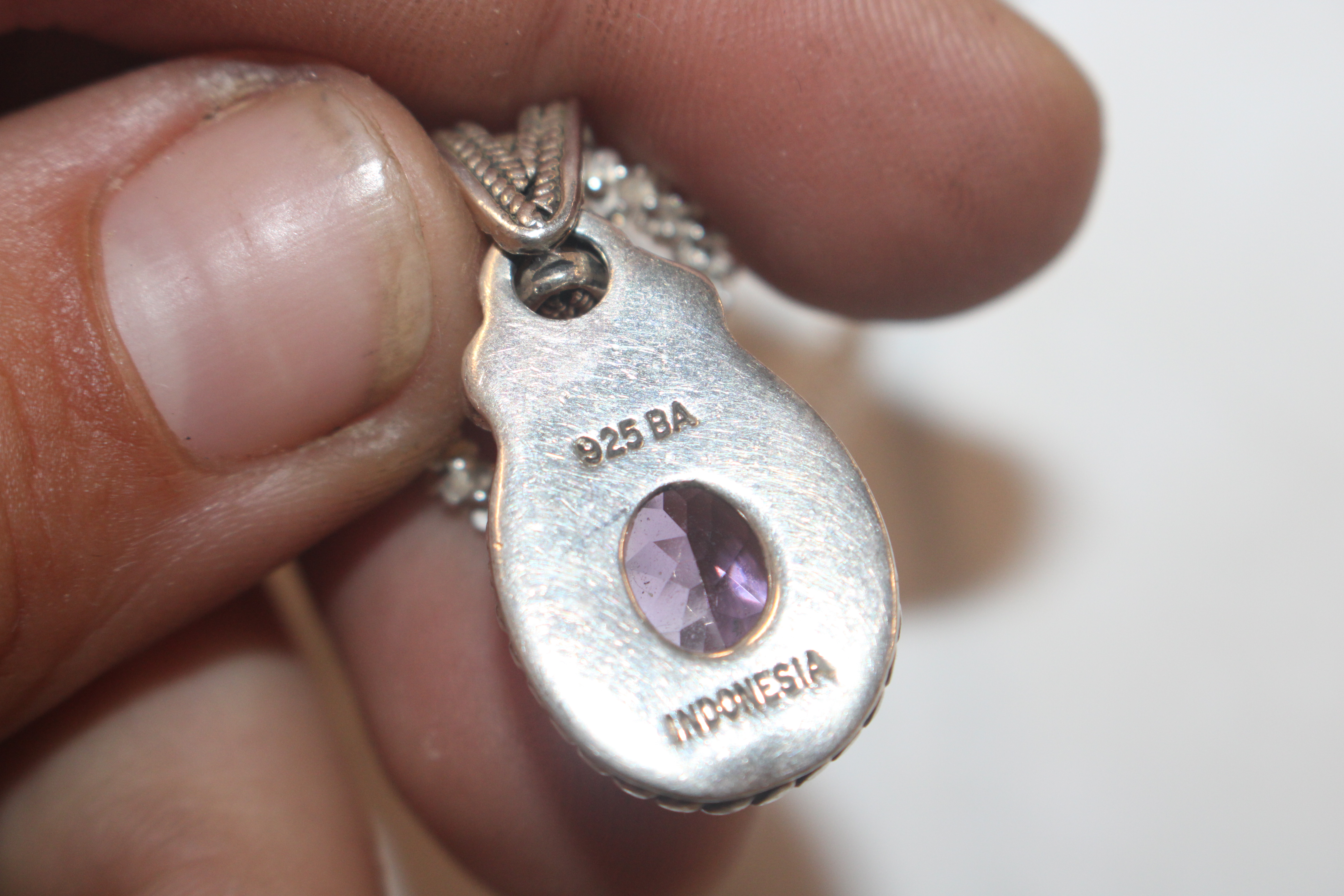 A Sterling silver and amethyst set pendant hung to - Image 4 of 6
