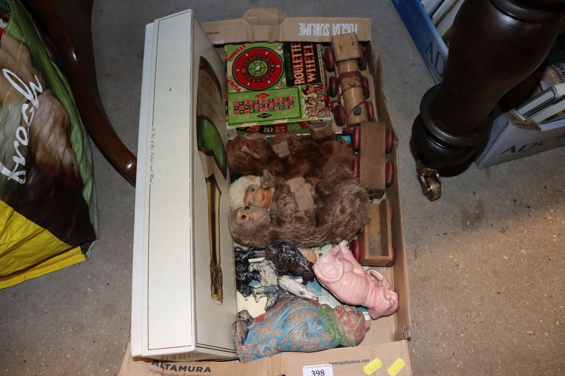 A box containing vintage hand puppets in the form