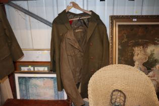 A battle dress, blouse, trousers and trench coat