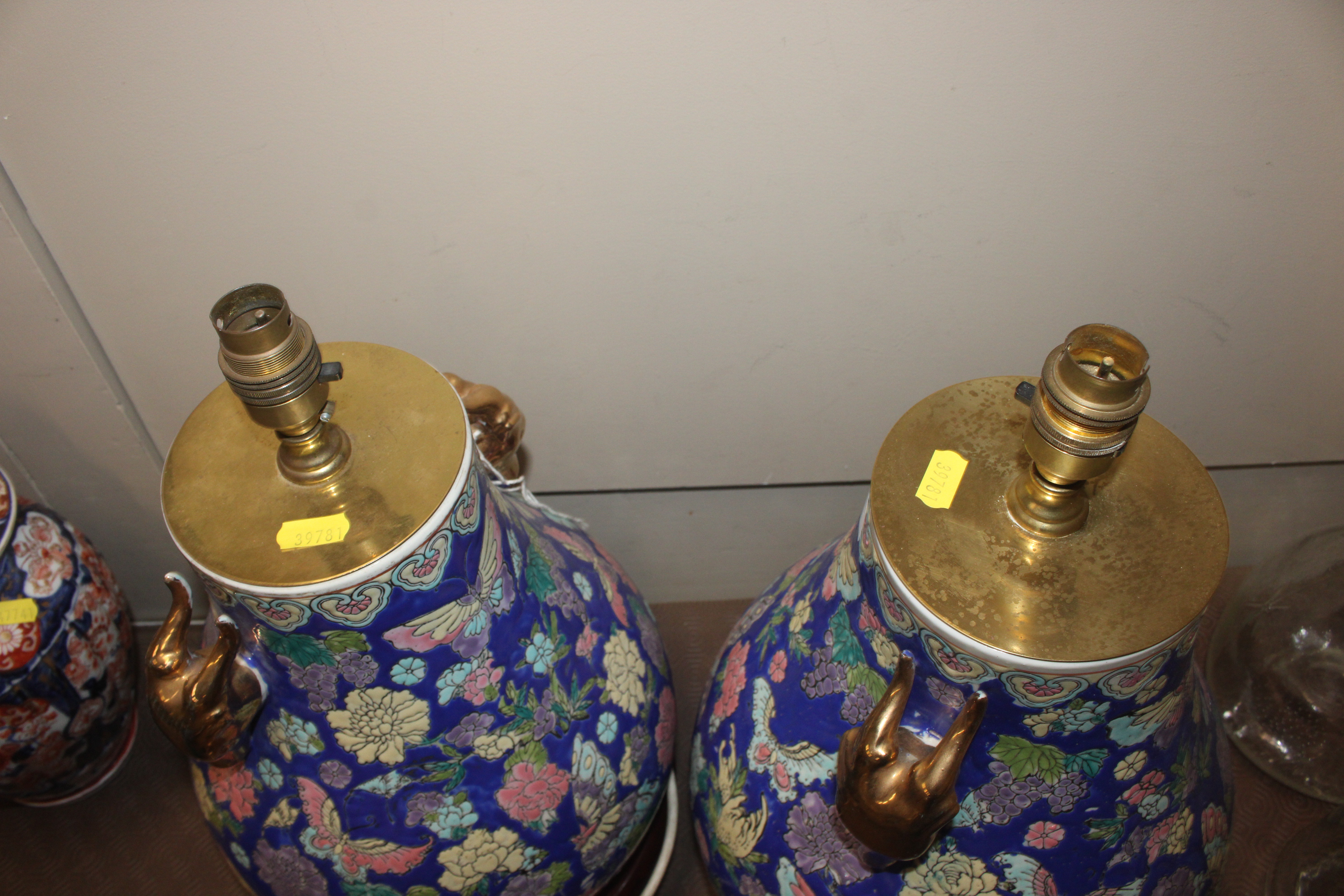 A pair of Oriental style ceramic table lamp bases with gilt rams head decoration on circular black - Image 9 of 9