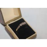 An 18ct gold and platinum three stone diamond ring