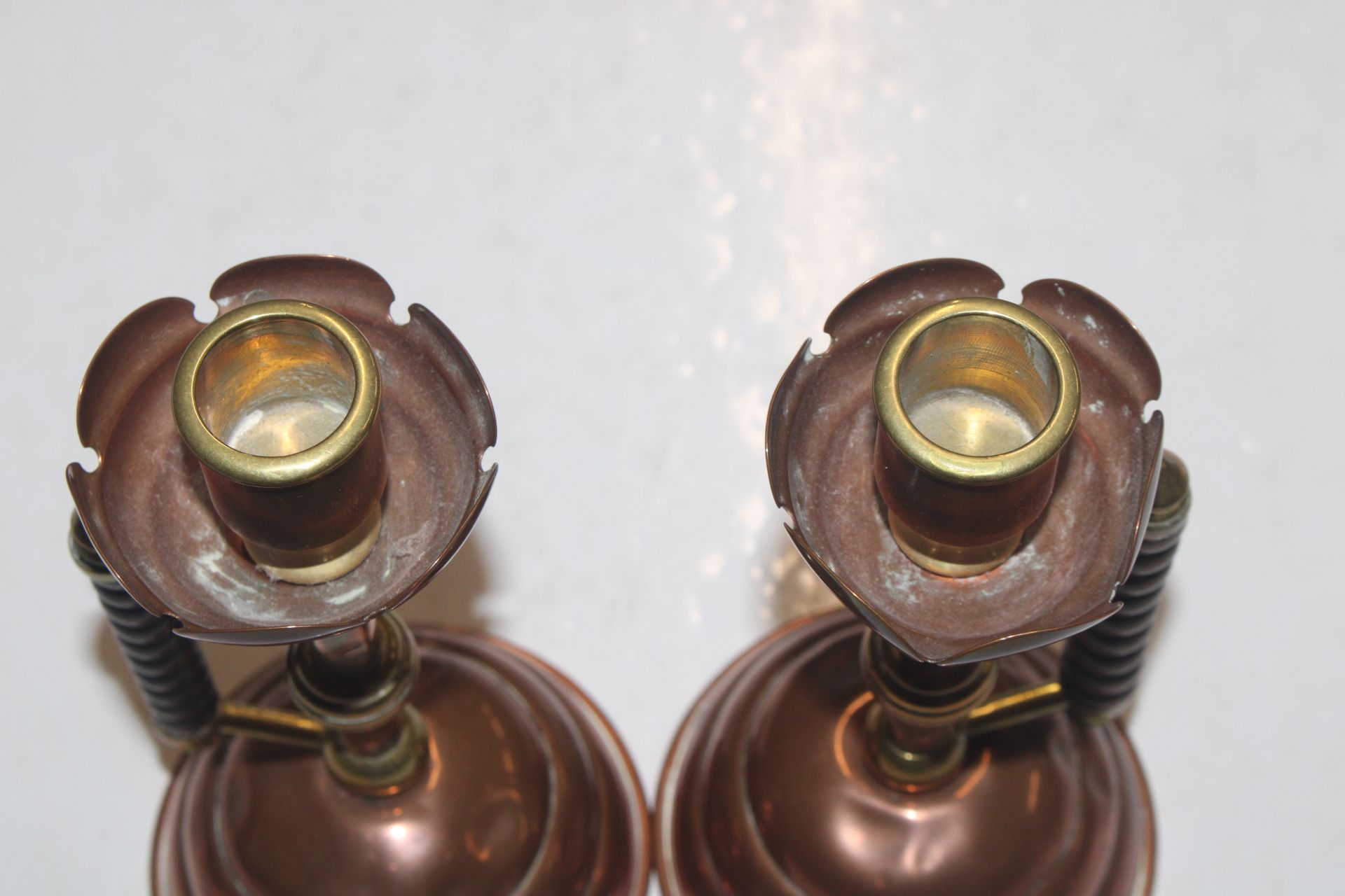 A pair of late Victorian brass and copper candlest - Image 5 of 9
