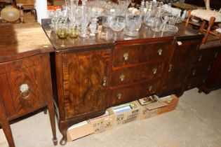 A mahogany sideboard fitted three central drawers