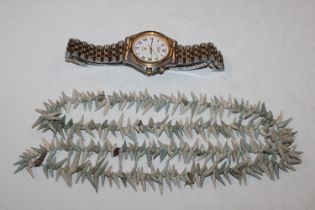 A Seiko wrist watch and a necklace formed from sea
