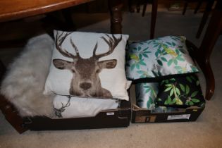 Two boxes of various cushions