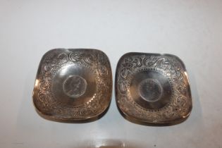 Two Sterling silver dishes inset with coins, engra