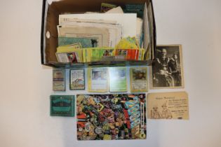 A box containing various ephemera; Pokémon cards a