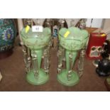 A pair of antique green glass lustre vases with