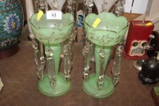 A pair of antique green glass lustre vases with