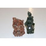 A Chinese carved dark green stone female figure an