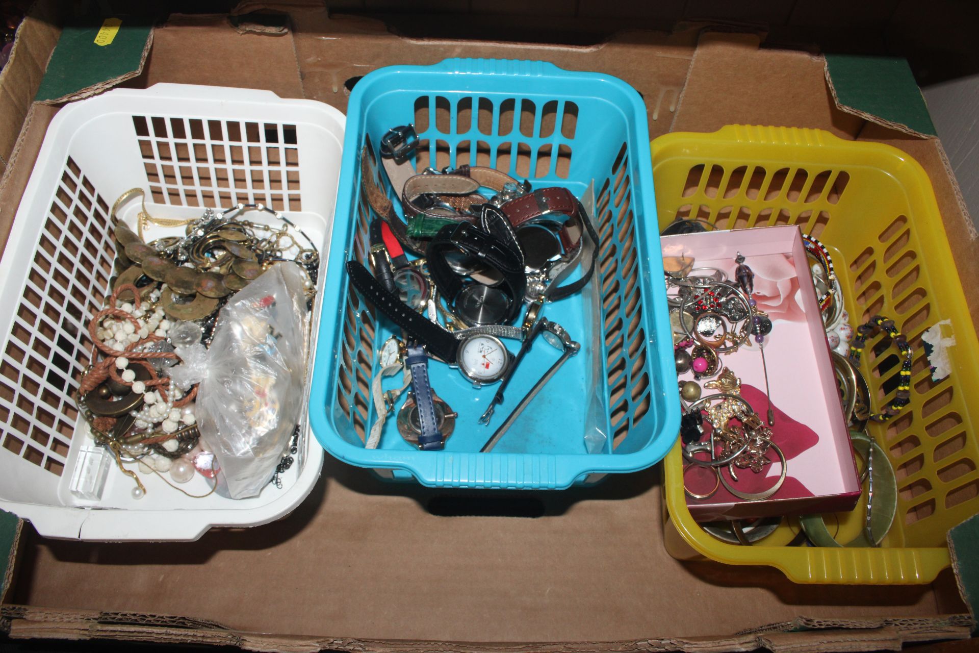 A box containing various costume jewellery, bangle