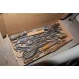 A box of assorted tools to include watchmakers