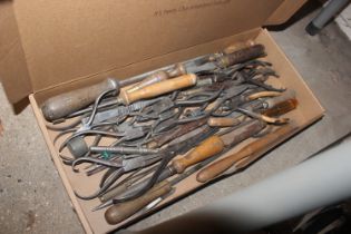 A box of assorted tools to include watchmakers