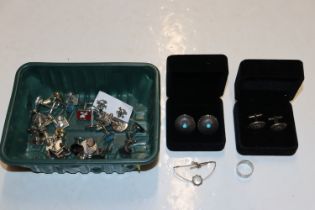 A box of various cuff-links