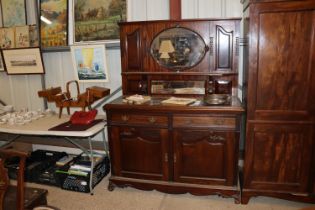 An early 20th Century mahogany and mirror backed s