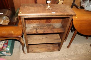 An oak open fronted bookcase