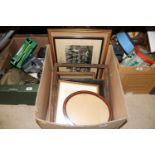 A box containing various photos and frames