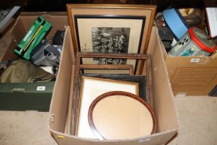 A box containing various photos and frames