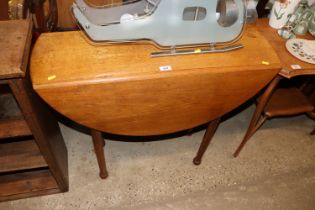 An oak drop leaf table