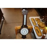 A carved oak cased banjo barometer / thermometer