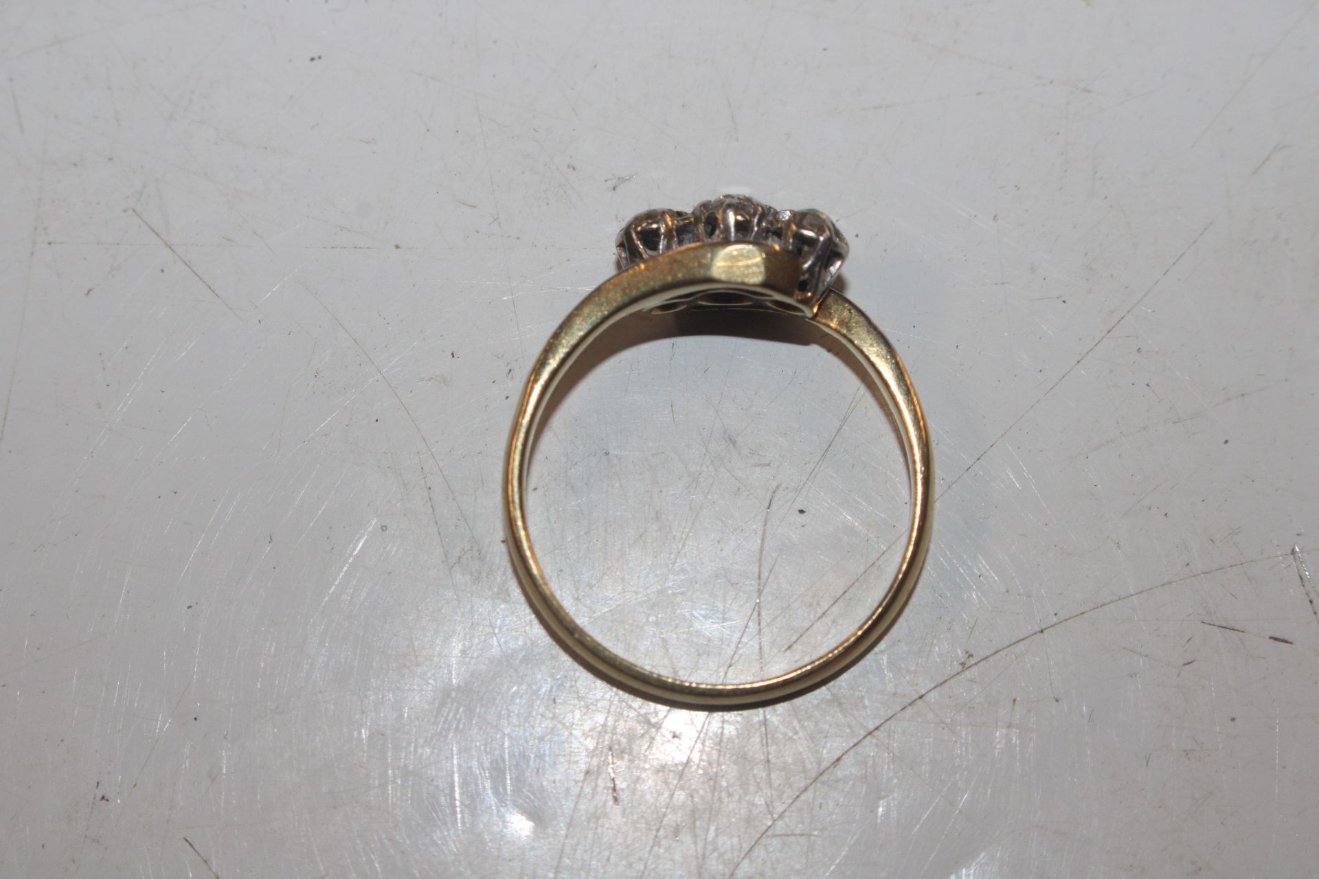 A 18ct gold and platinum diamond three stone ring, - Image 3 of 5