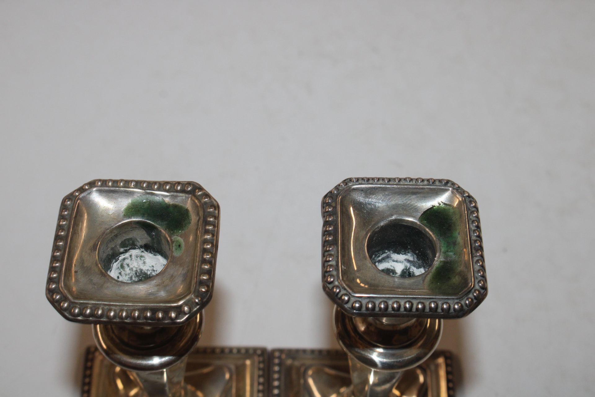 A pair of silver candlesticks with weighted bases - Image 4 of 7