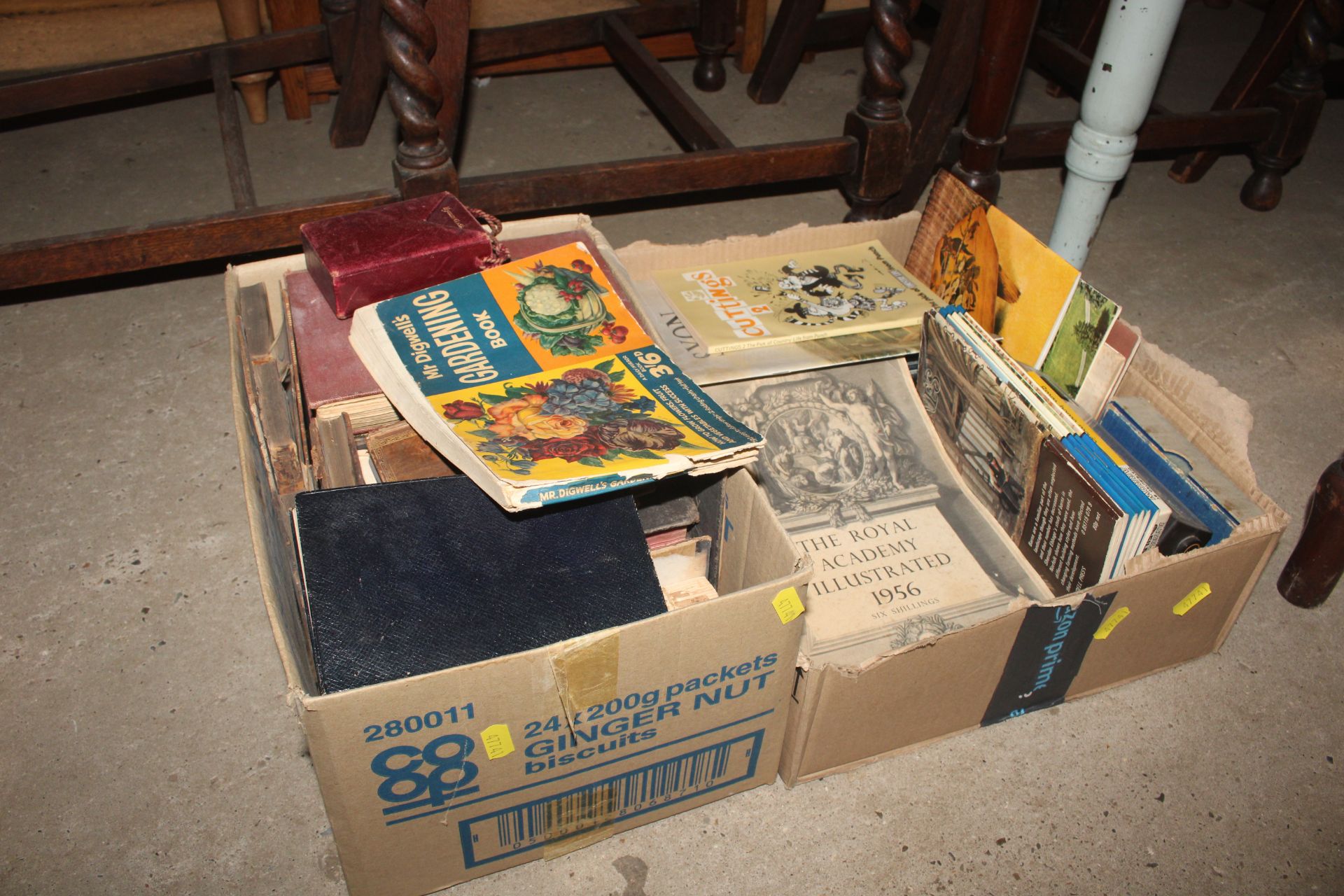 Two boxes of various books to include antique Bibles, postcards, Imperial Quill tin