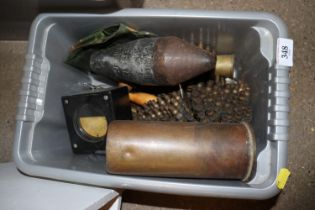 A crate of mixed ammo belts, shell cases, etc.