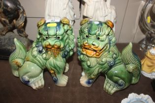 A pair of large Chinese spinach glazed Dogs of Fo