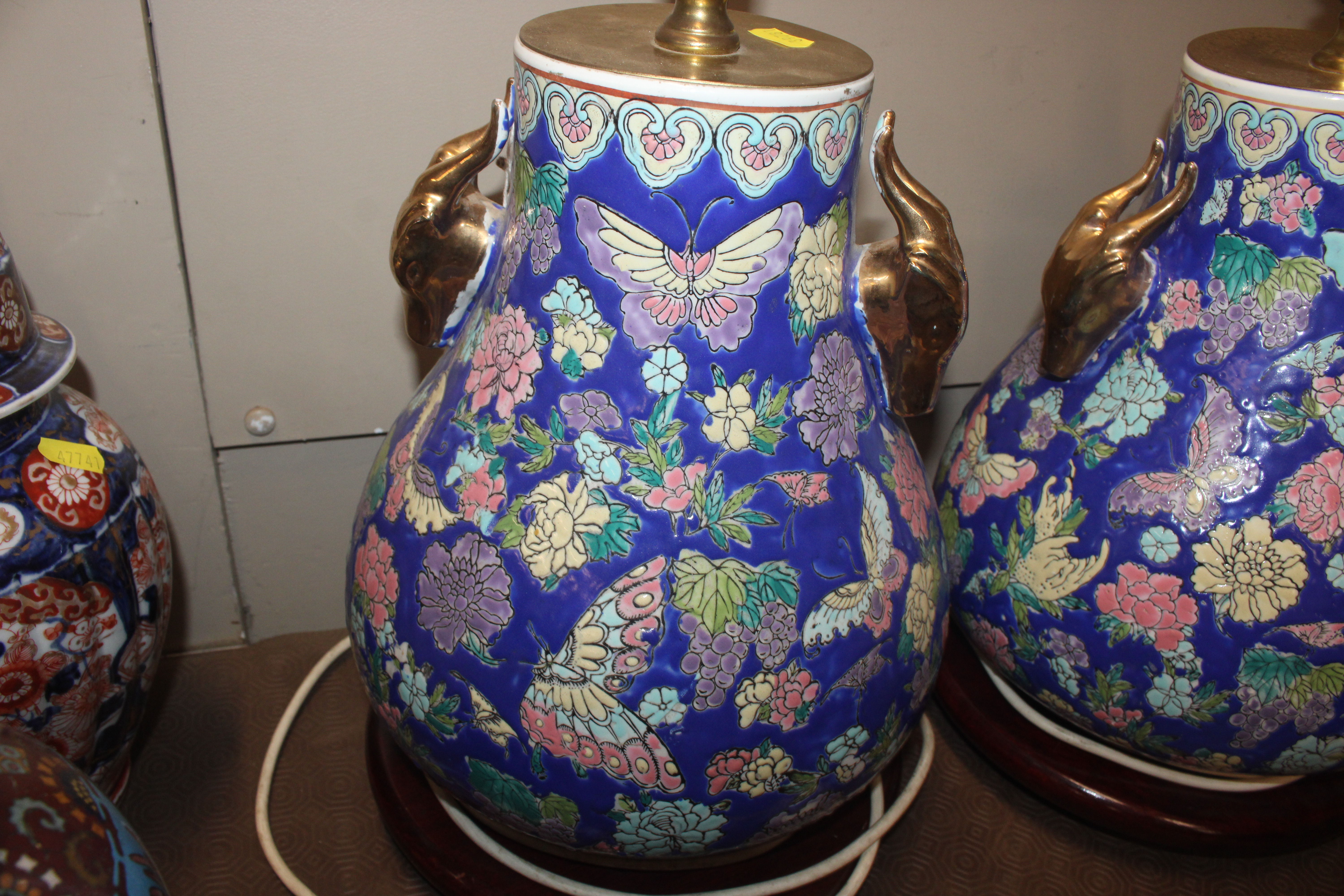 A pair of Oriental style ceramic table lamp bases with gilt rams head decoration on circular black - Image 7 of 9