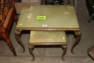 A nest of two onyx and brass coffee tables