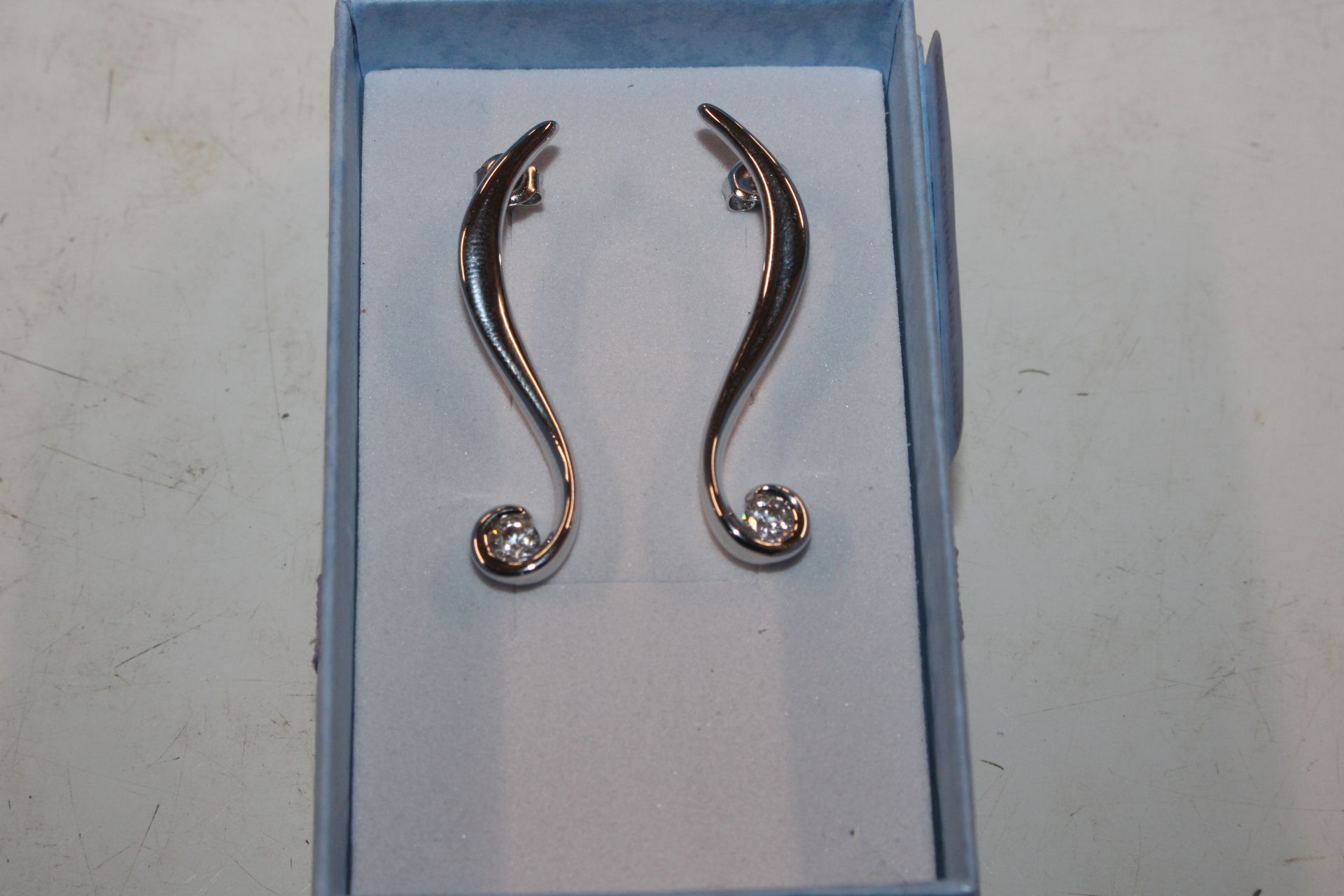 A pair of long Sterling silver and cubic zirconia
