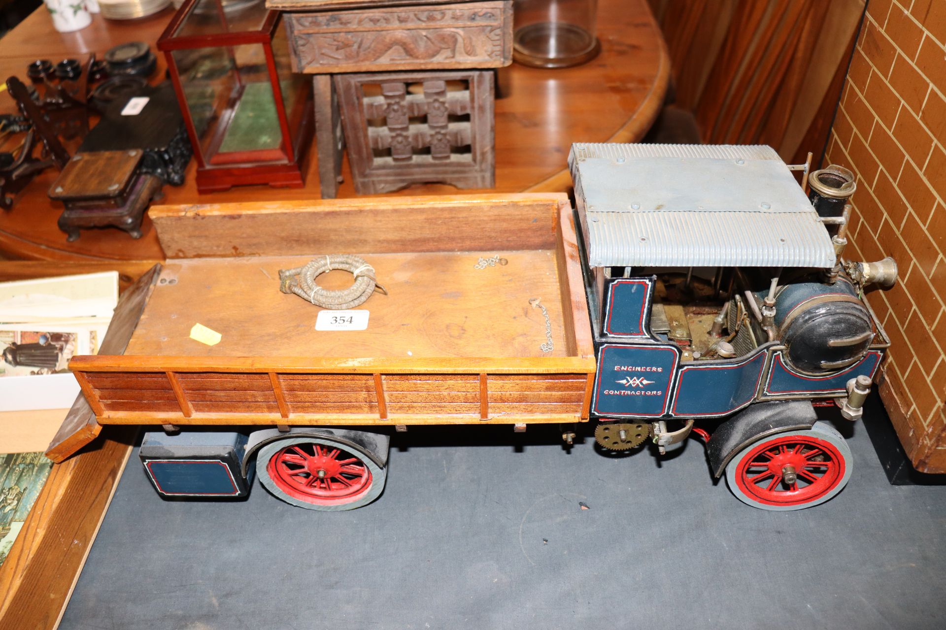 A tin plate spirit fired model of a steam road wagon