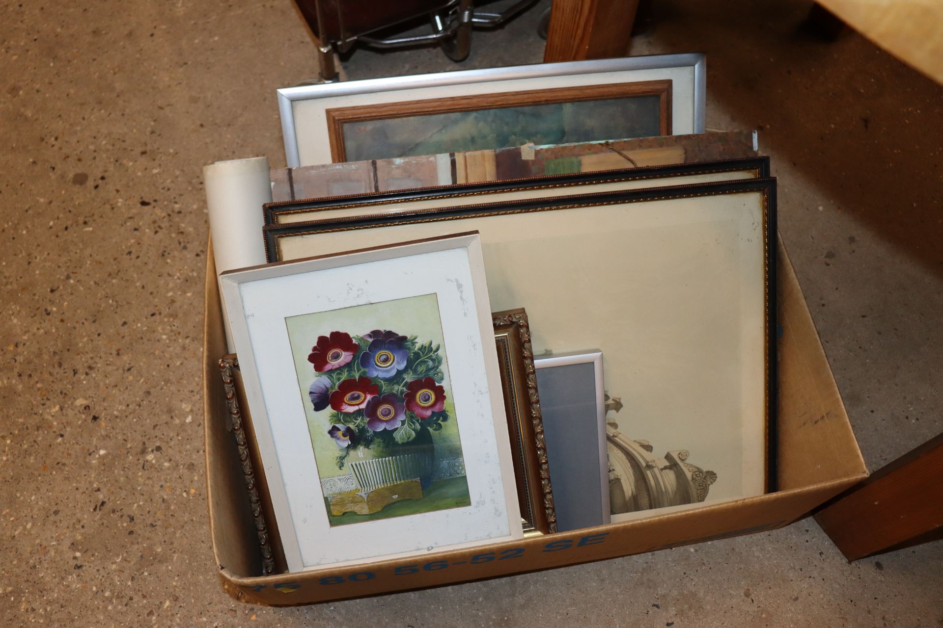 A box of various pictures and prints