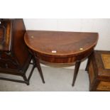 A 19th Century mahogany and cross banded demi-lune