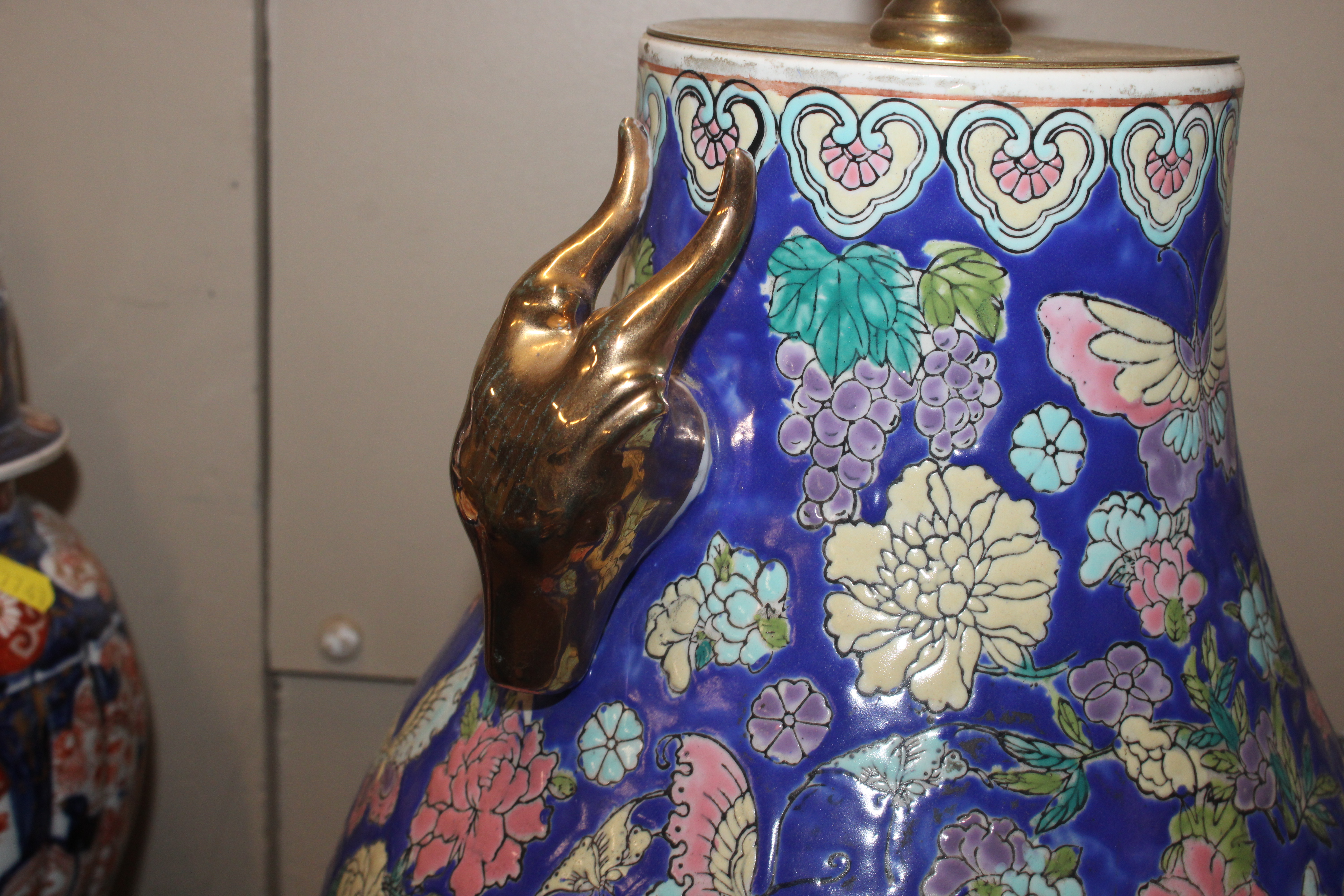 A pair of Oriental style ceramic table lamp bases with gilt rams head decoration on circular black - Image 6 of 9