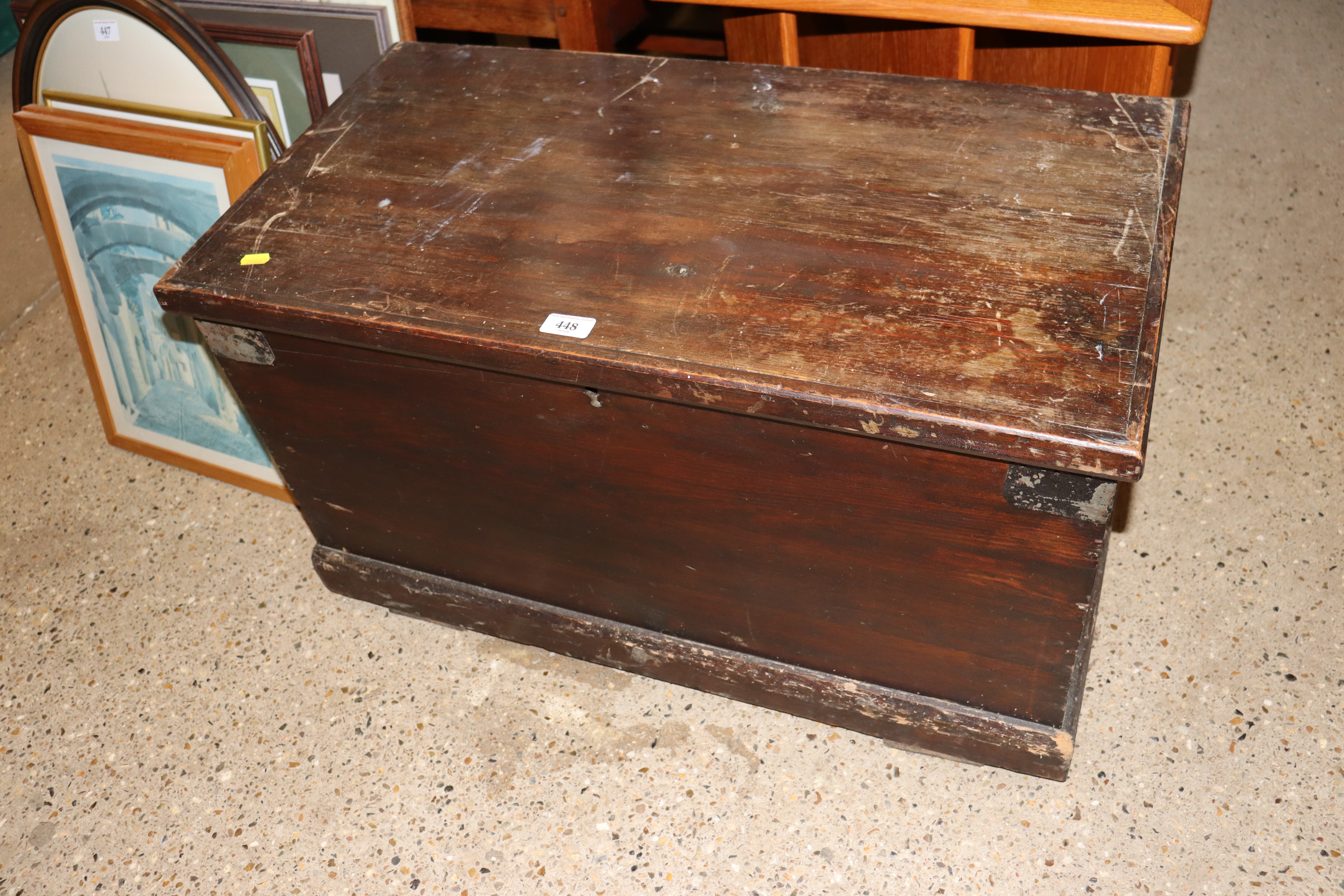 A stained pine storage trunk