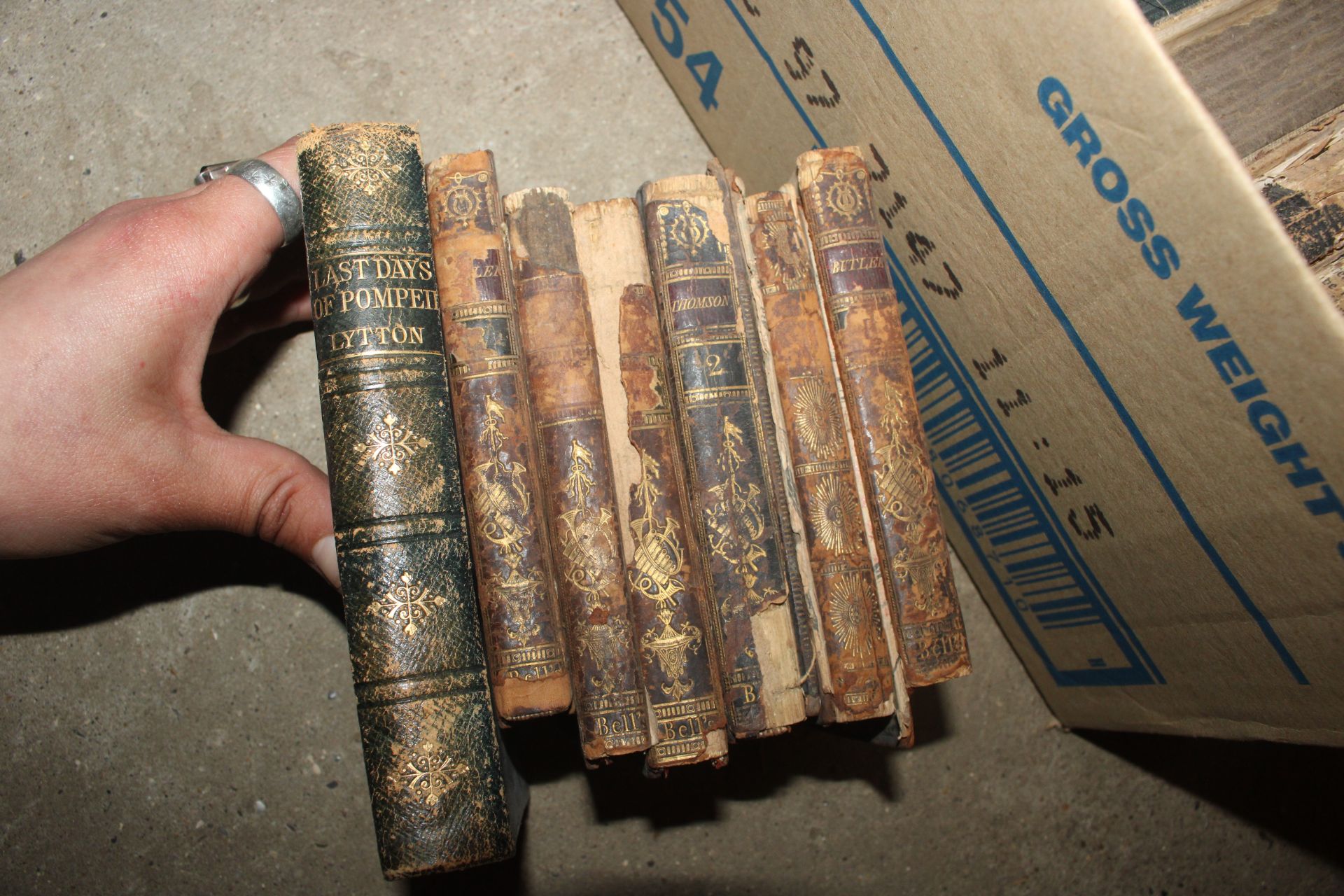 Two boxes of various books to include antique Bibles, postcards, Imperial Quill tin - Image 10 of 30