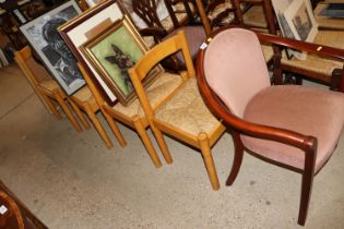 A pink upholstered armchair and a set of four Vico