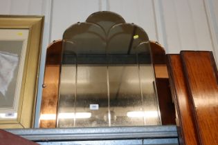 An Art Deco segment panelled wall mirror of Odeone